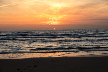 Scenic View Of Sea Against Orange Sky
