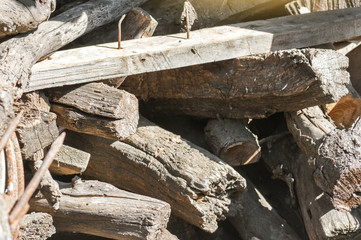 Old wooden boards and firewood for heating