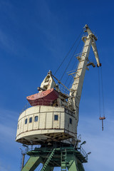 Fototapeta na wymiar Heavy old crane at the Harbor. Riga, Latvia