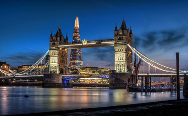 Tower Bridge, The Shard, and London Skyline at dusk. 