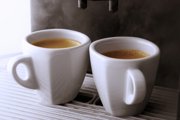 Cups of Espresso being poured