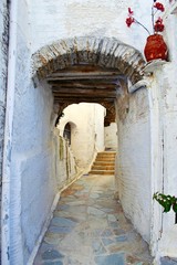 Narrow street at Triantaros village, Tinos island, Cyclades, Greece.