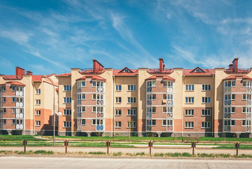 Naklejka premium Residential buildings with balconies in the city, urban development of apartment houses. Ostrovets, Belarus