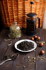 black tea welding on a platter on a dark wooden background
