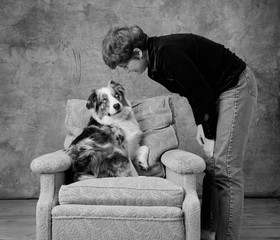 Dog on chair with owner