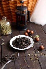 black tea welding on a platter on a dark wooden background