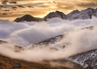 Sunrise in National Park Gran Paradiso. Beautiful sunrise scenery. Mist during sunrise in Alps (Italy), beautiful mountains view, magical sunrise in mountains, autumn, colourful landscape scenery