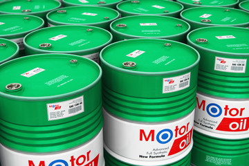 Group of stacked barrels with motor oil lubricant in warehouse