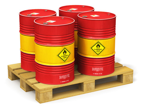Group of red oil drums on shipping pallet isolated on white