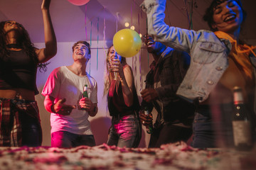 Friends dancing at a house party