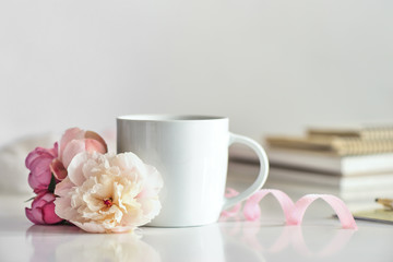 Cup of coffee or tea on working desk