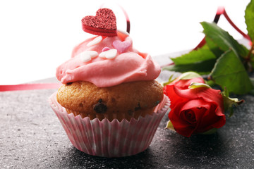 Delicious cupcake for Valentine Day. cake for Valentines day with chocolate and strawberries. Traditional homemade with red roses