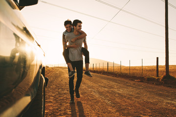 Couple enjoying outdoors on a mud track