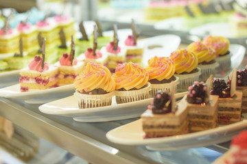 the cakes in the bakery window