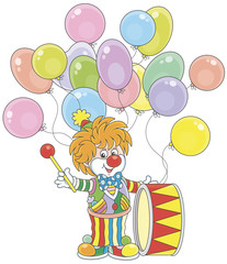 Funny circus clown beating his colorful drum, vector illustration in a cartoon style