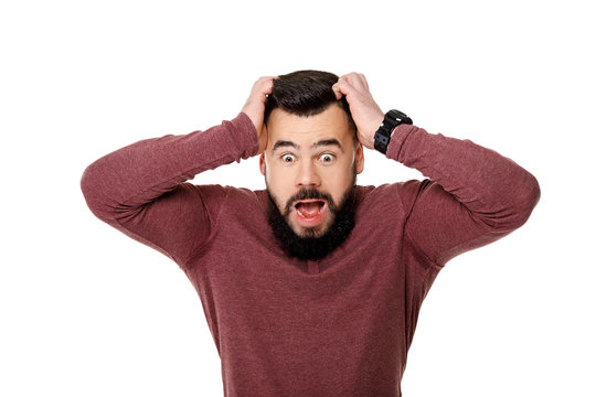 bearded football fan screaming on white background.