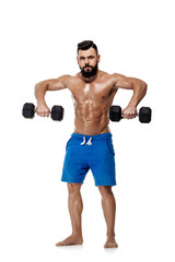 Fototapeta na wymiar muscular man doing exercises with dumbbells.
