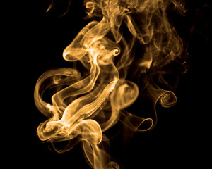 Smoke rising against black background