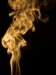 Smoke rising against black background