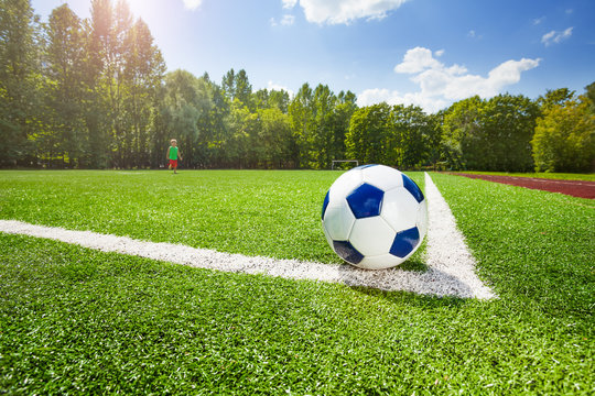 Corner and ball on the field of soccer stadium