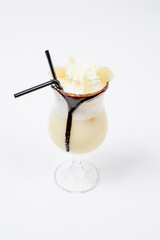 pina colada in martini cocktail glass white background