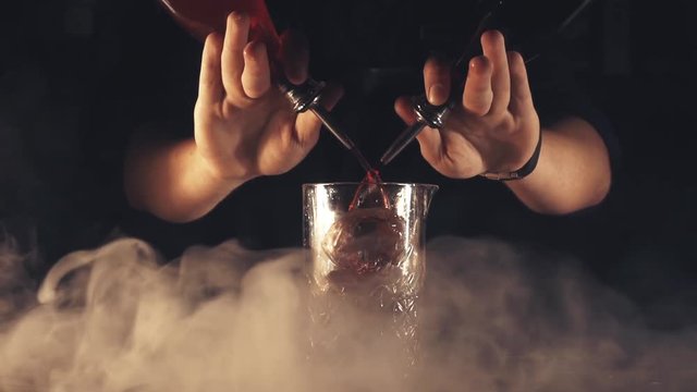 Barman make a cocktail