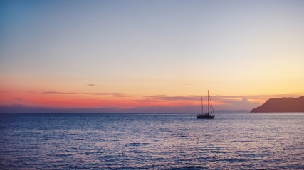 Sunset. beautiful boats at sea
