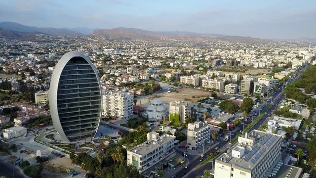 Aerial drone shot flying over Limassol Oval and city streets in Cyprus