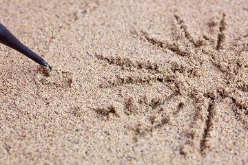 Child draws a stick on the sea with the sun. Children's drawing.