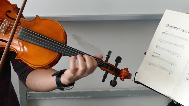 4K Close-up of musician playing violin.


