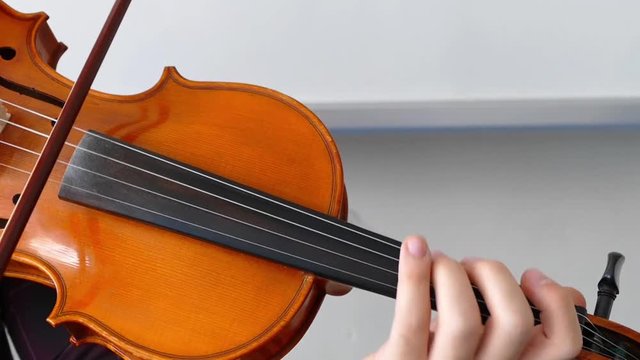  Close-up of musician playing violin,turkish music.Violinist playing the violin at the school,


