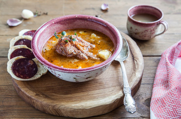 Goulash soup with meat and potatoes, close view, rustic style