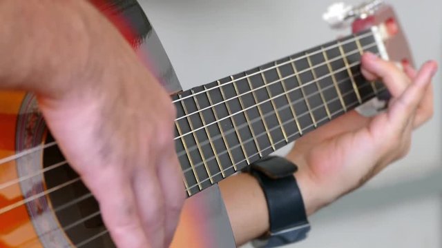 Video guitar playing close fingers and strings,

