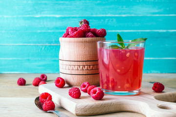 kissel of raspberry, russian traditional drink, national cuisine, fresh berries, rural style, blue wooden background
