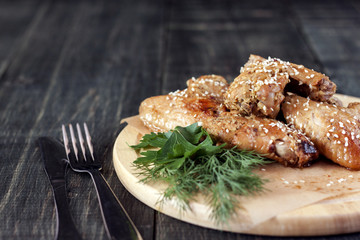 Chicken wings on a serving board