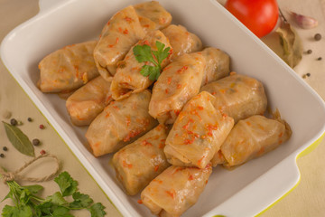 Russian cabbage roll and tomato sauce in baking tray. Top view.