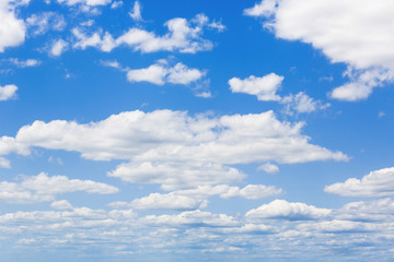 Blue sky with white puffy clouds. Clouds in the blue sky.
