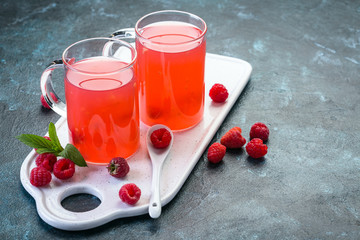 kissel of raspberry, russian traditional drink, national cuisine, fresh berries, dark stone background