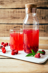 kissel of raspberry, Russian traditional drink, national cuisine, fresh berries, rural style, wooden background