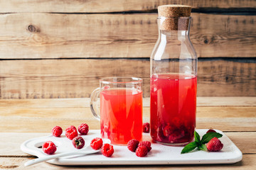kissel of raspberry, Russian traditional drink, national cuisine, fresh berries, rural style, wooden background