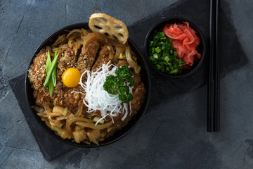 Rice bowl topped with fried pork cutlet Katsudon, tonkatsu donburi, japanese cuisine