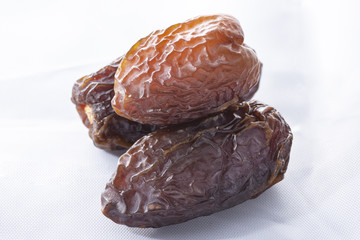 dried dates on a white background