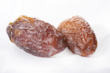 dried dates on a white background