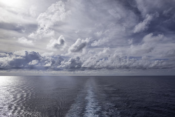 sailing under dramatic sky