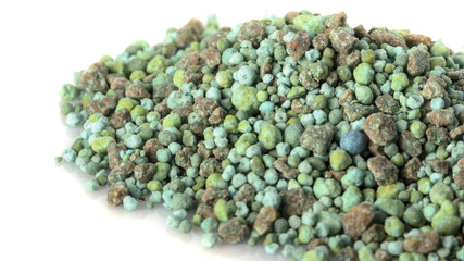 Heap of mineral fertilizers, isolated on the white background