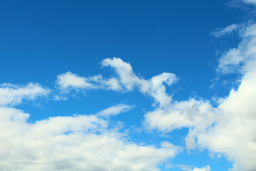 Beautiful natural blue sky and white fluffy clouds. Background. Landscape.