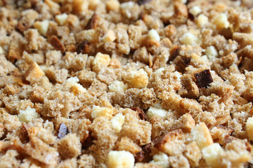 Finely chopped rusks. Dried bread diced. Close-up. Background.