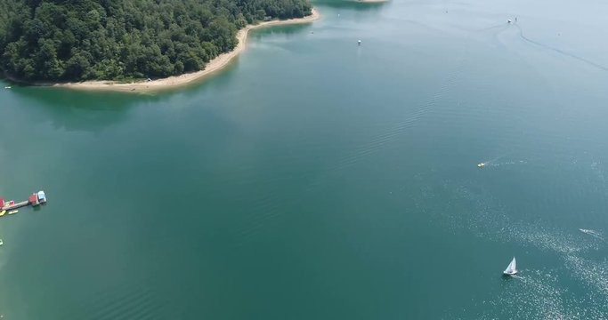 Flight over summer Solina Lake in Polish Bieszczady Mountains