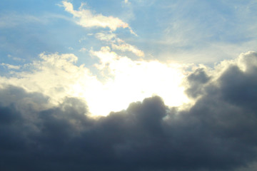 Obraz premium A beautiful cloudy sky, cumulus clouds and scorching sun. Background. Landscape.