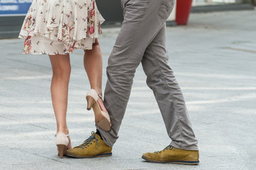 closeup of legs of couple of tango dancers in the street © pixarno